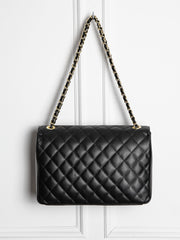 Quilted leather bag with gold details