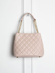 Small quilted leather bag with gold detail 