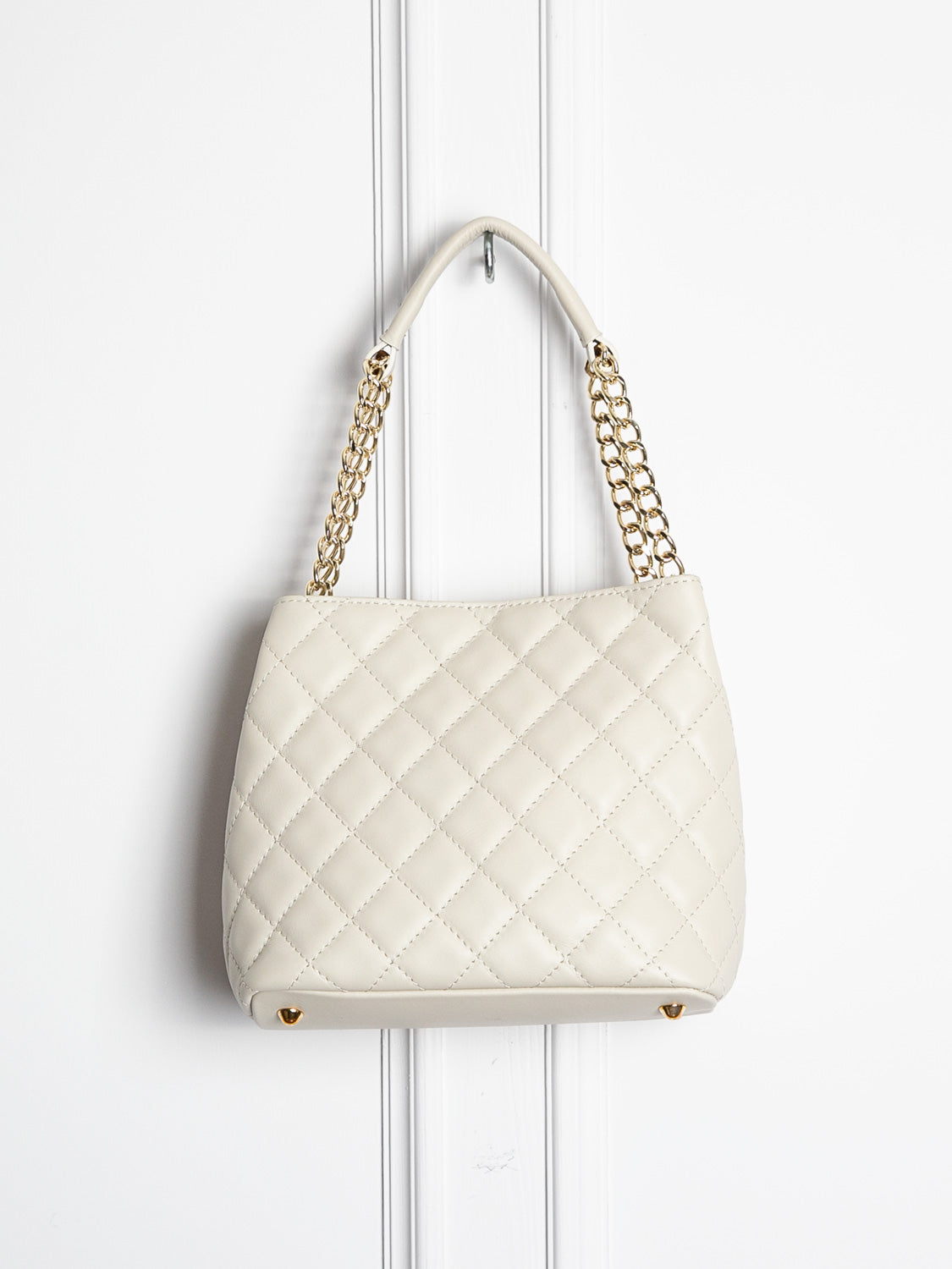 Small quilted leather bag with gold detail 