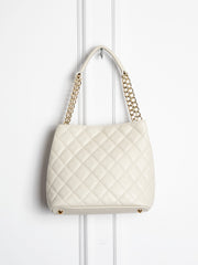 Small quilted leather bag with gold detail 