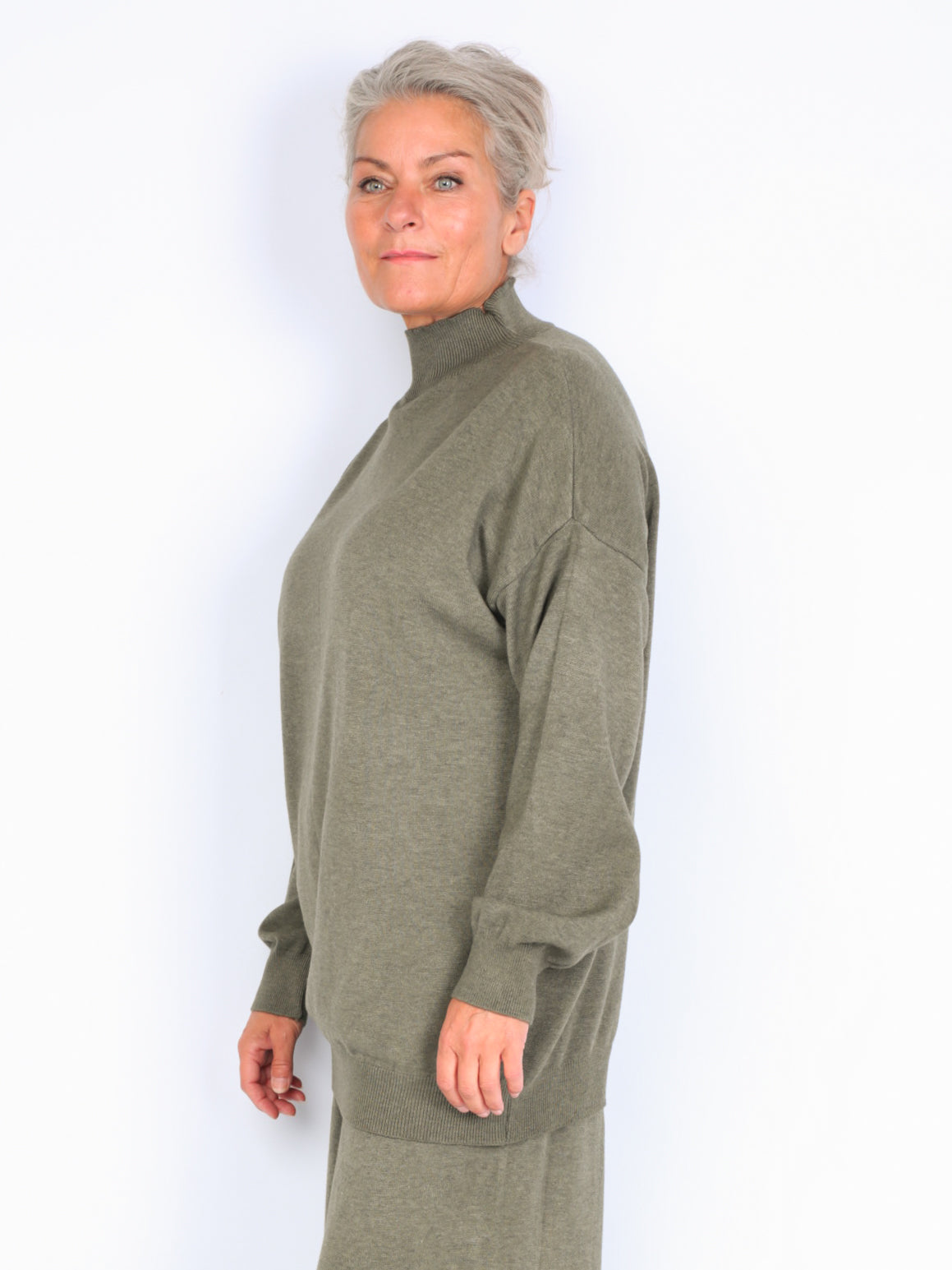 Knitted sweater with high neck