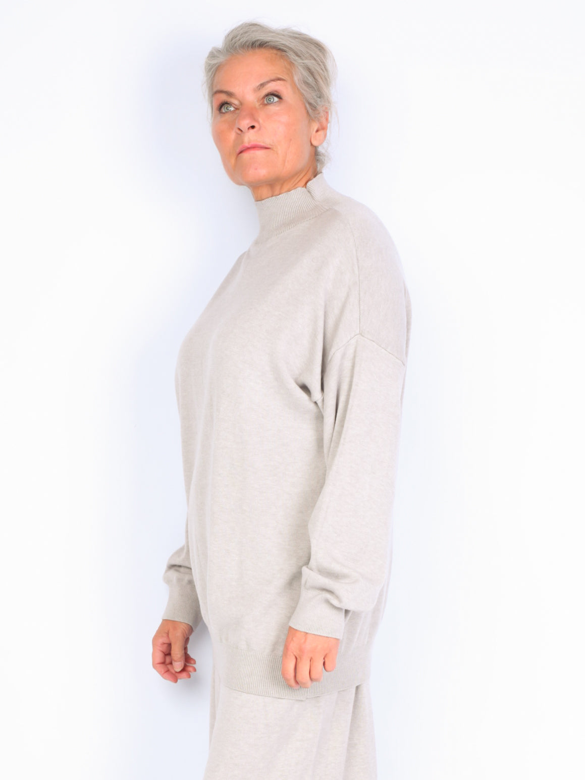 Knitted sweater with high neck