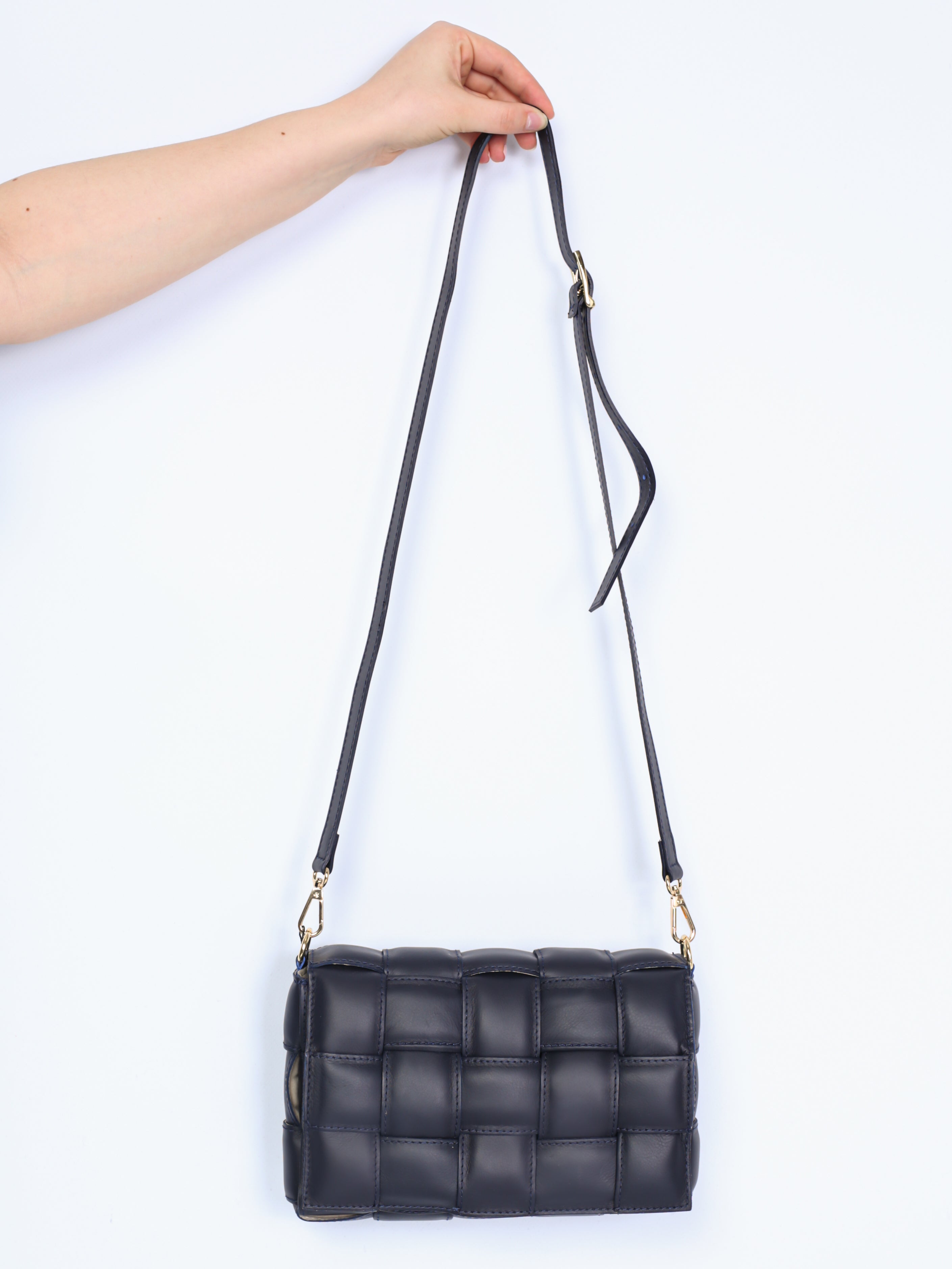 Braided leather bag with gold details