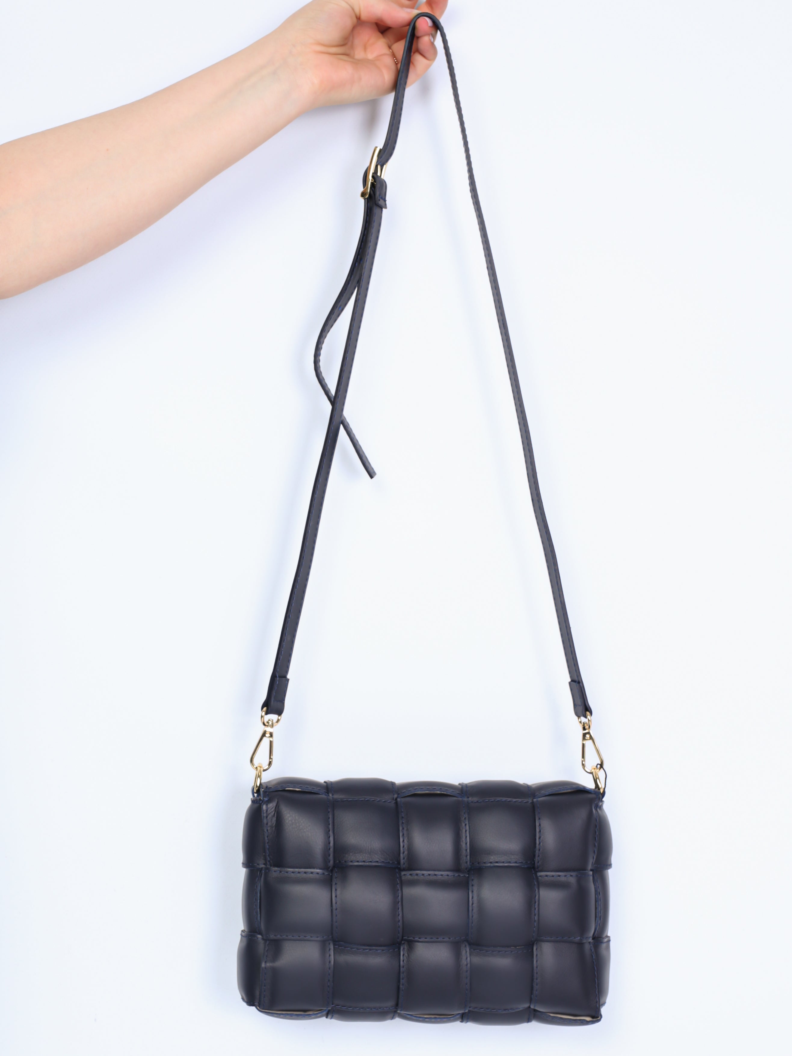 Braided leather bag with gold details