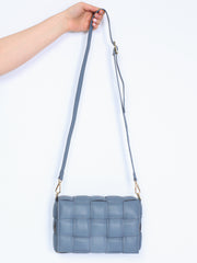 Braided leather bag with gold details