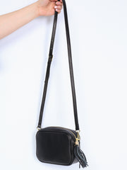 Leather bag with fringe pendant